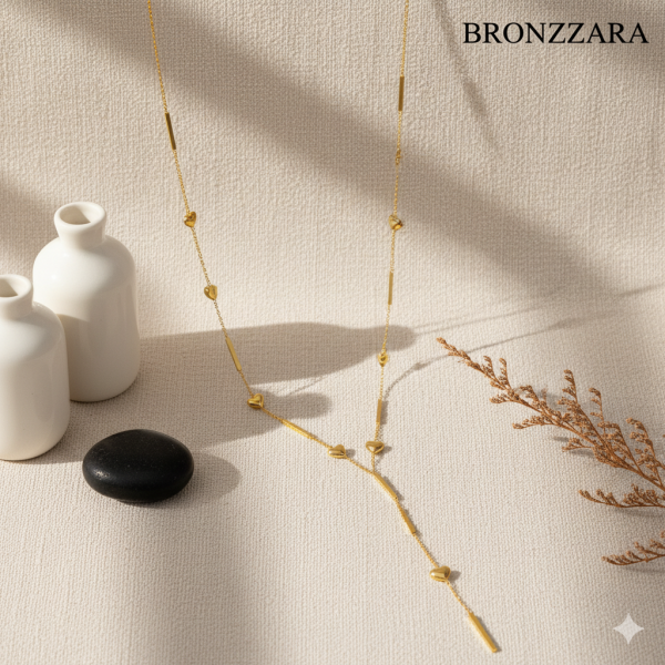 KALP DETAYLI GOLD ÇELİK Y KOLYE