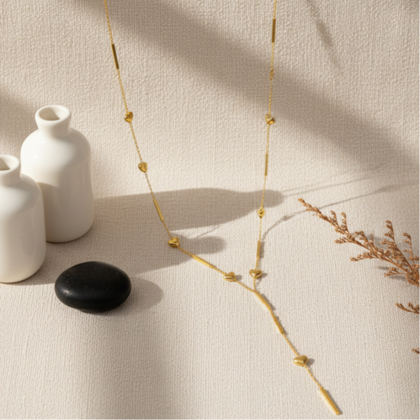 KALP DETAYLI GOLD ÇELİK Y KOLYE